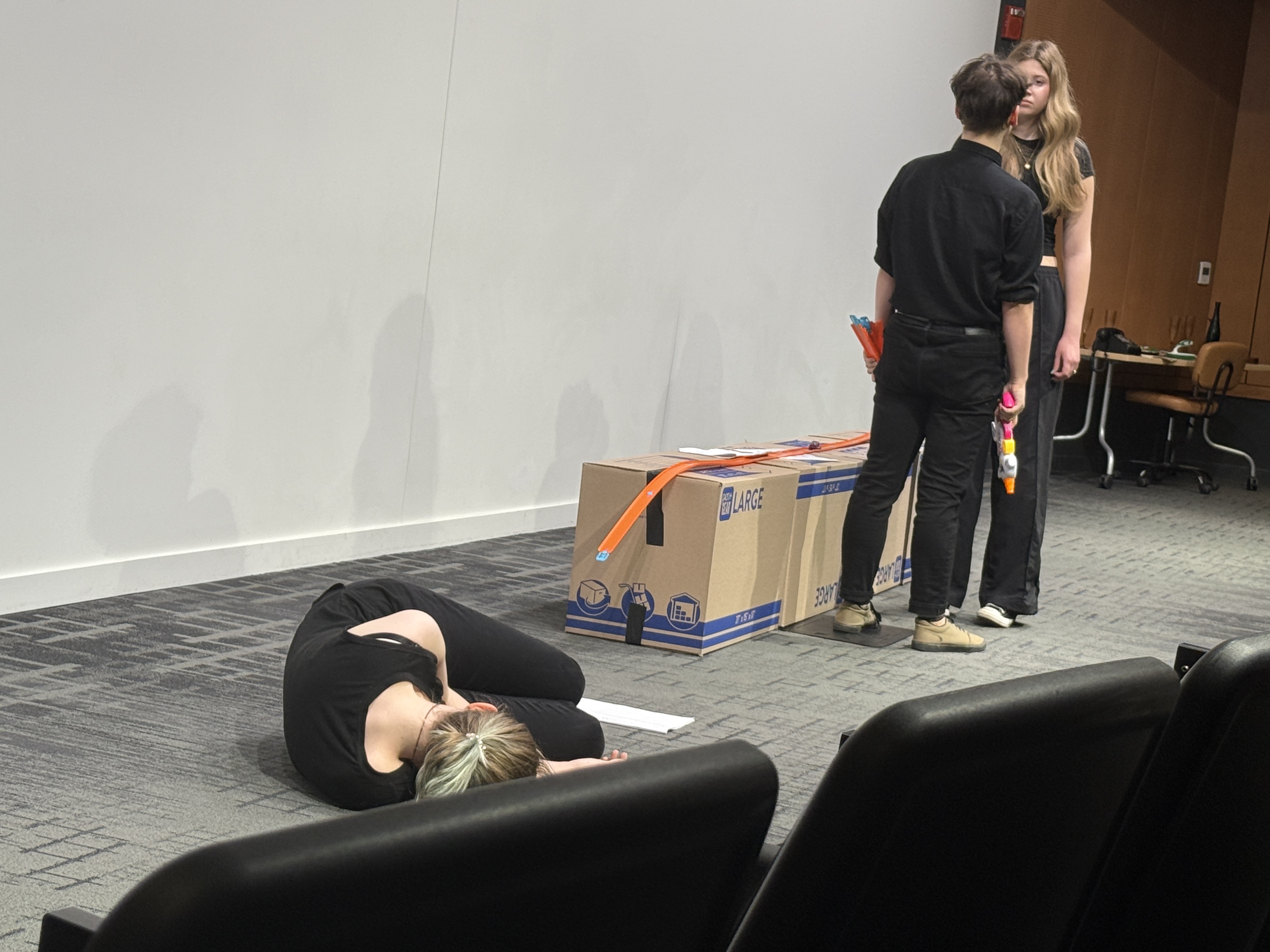 Tobias Sanders as Id and Ella Galens as Ego confrontation with Veronica Thomas as Superego dead in "Apathy" in the Facility for Rare Isotope Beam (FRIB) Produced by Second Stage Playwriting