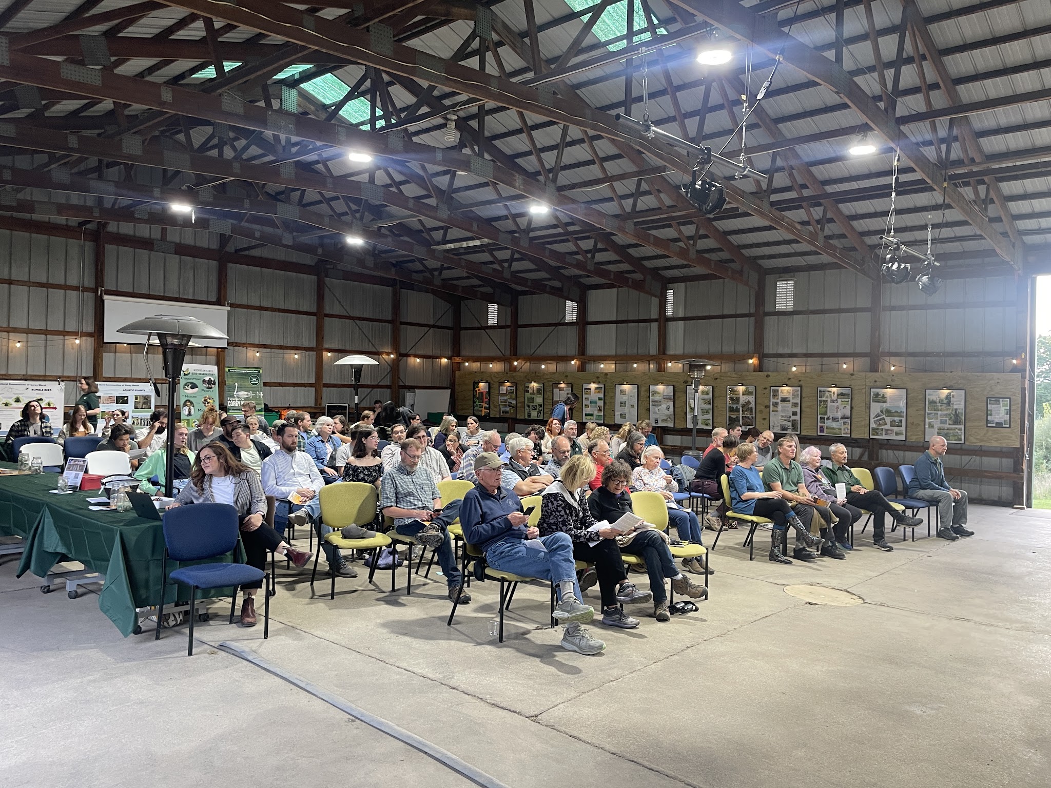 Picture of the audience of Noah Trapp, Savannah Jordan, and Reese Verlinde in Savannah Jordan, and Reese Verlinde as Plein Air Painter in 'The Link" in the barn at Corey Marsh Ecological Research Center (CMERC)