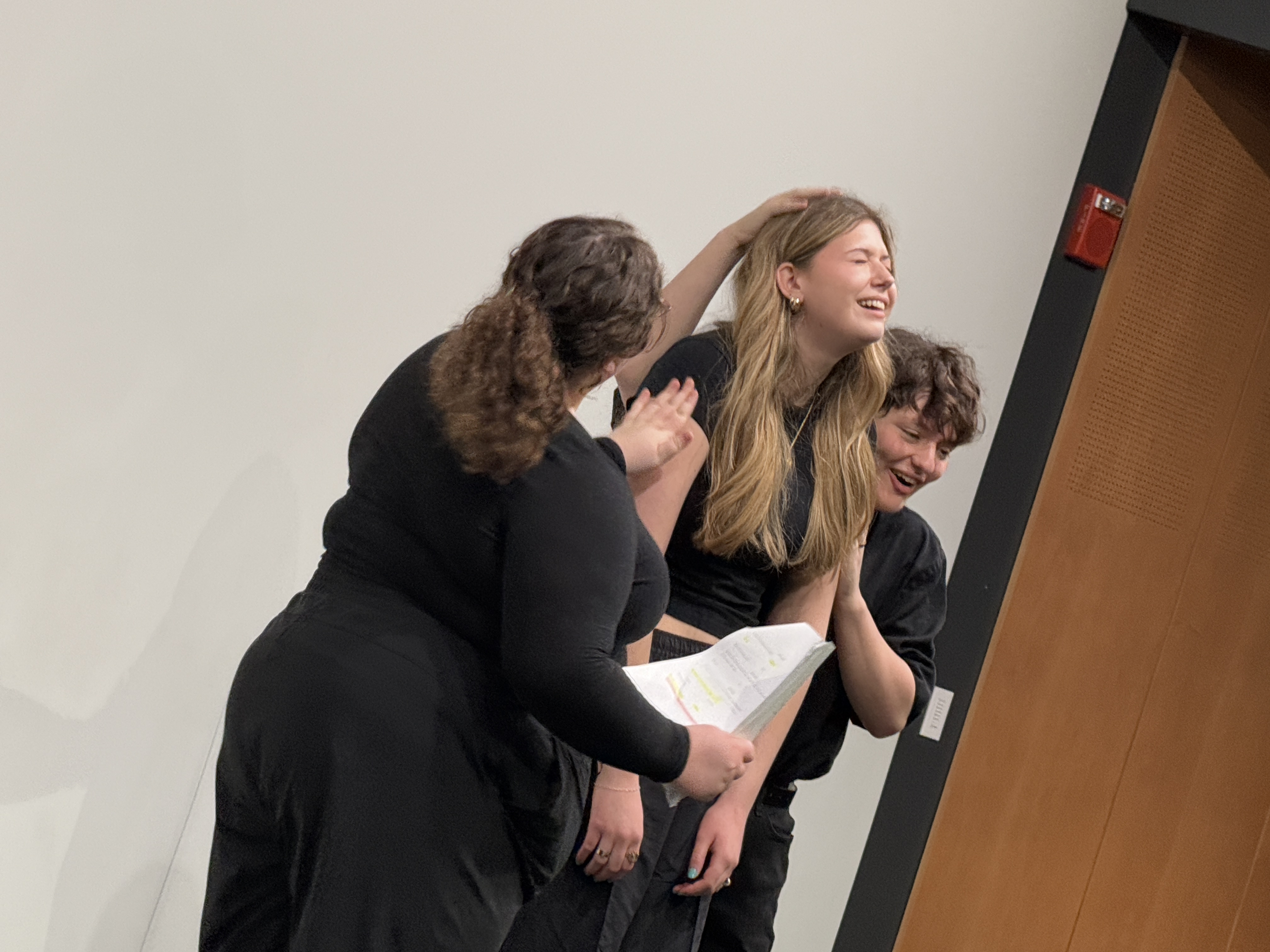 Reese Verlinde as Larkin and Tobias Sanders as Jay attempt to comfort Ella Galens playing Howard awkwardly in "Friday Morning with the Franklins" at the Facility for Rare Isotope Beams (FRIB) produced by Second Stage Playwriting