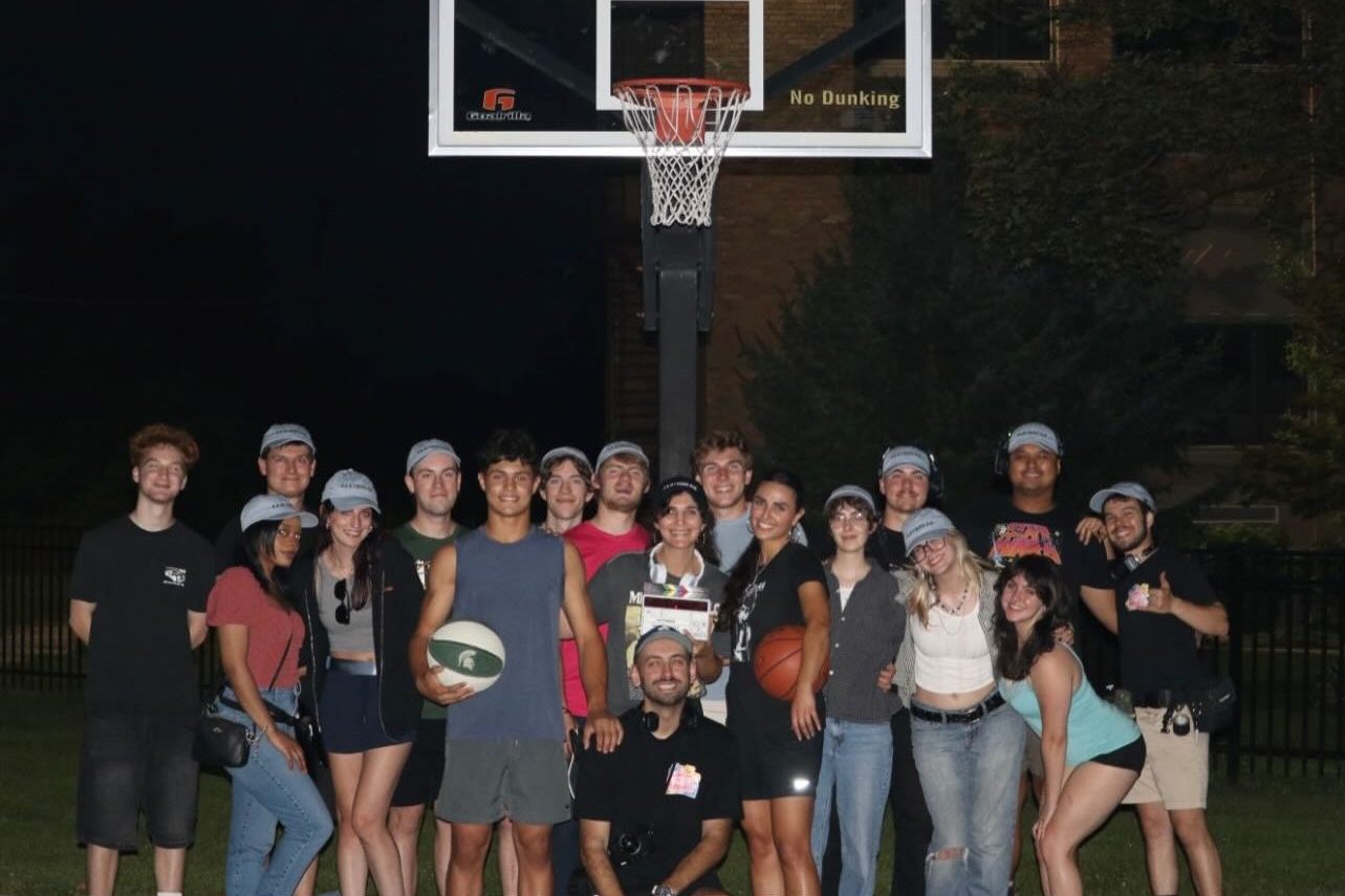 Film Crew of "Fastbreak" by Margo Sawaya under a basketball hoop