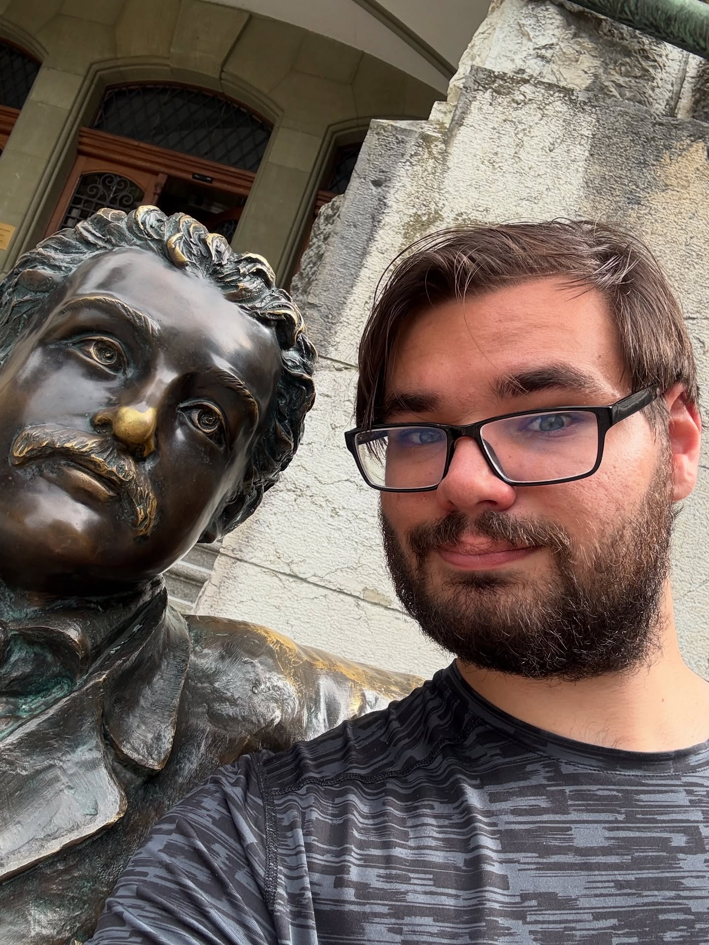 Playwright and director Anthony Monteleone with a bronze statue of Albert Einstein in Bern, Switzerland