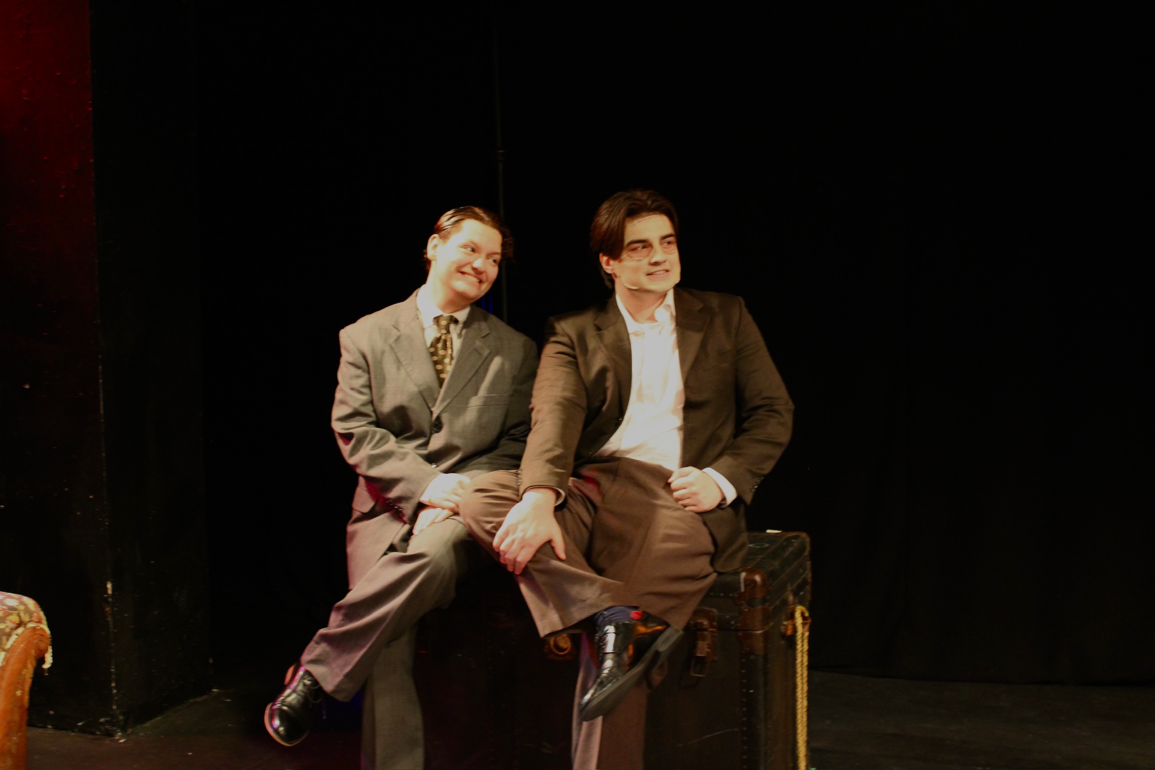 Tobias Sanders as Mortimer Brewster and Tyler Radze as Jonathan Brewster sitting sitting on a trunk/window seat in Second Stage Productions "Arsenic and Old Lace"