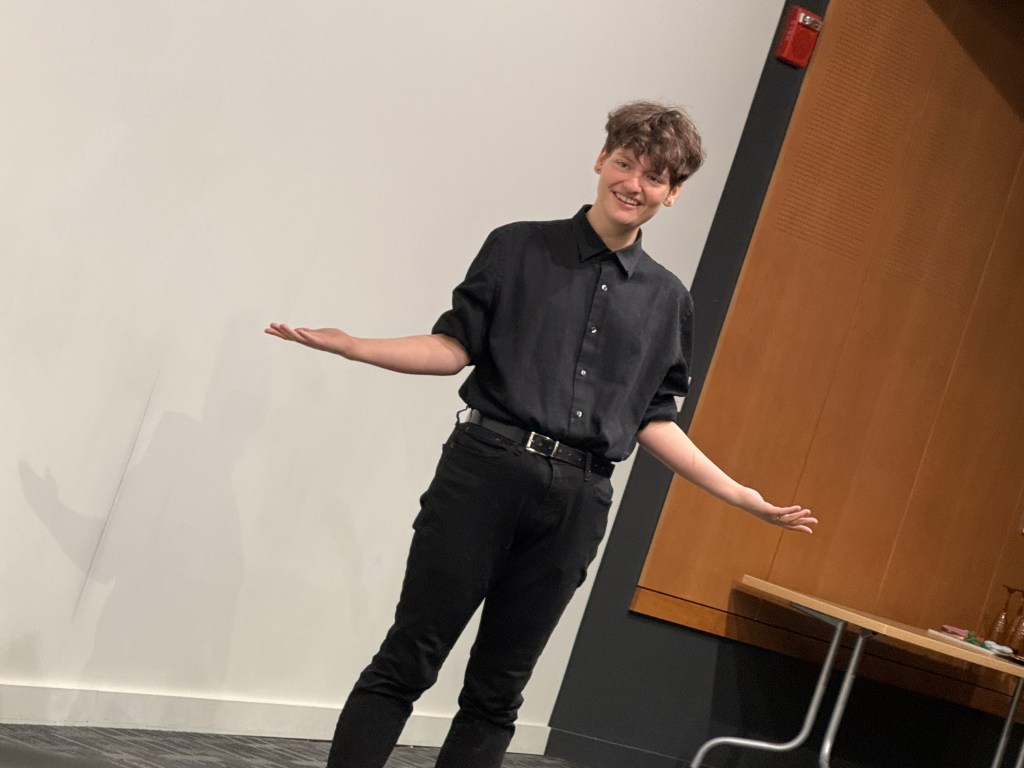 Tobias Sanders stands awkwardly during Second Stage Playwriting at the Facility For Rare Isotope Beams (FRIB)