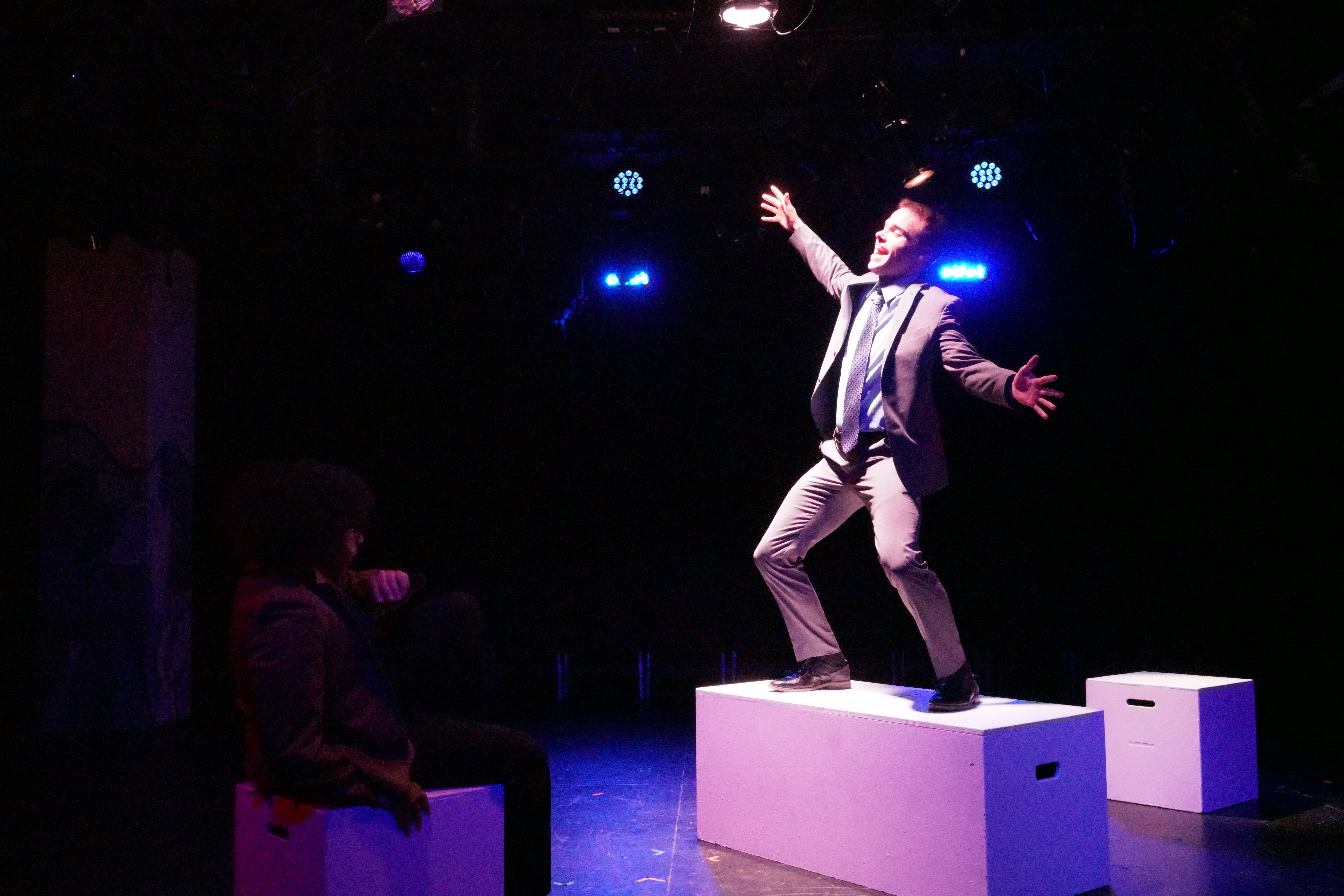 Logan Verlinde as Mr. Davidson standing on block in "What Do You Want Paul" in Second Stage Productions "The Guy Who Didn't Like Musicals"